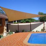 Cream shade sail near pool