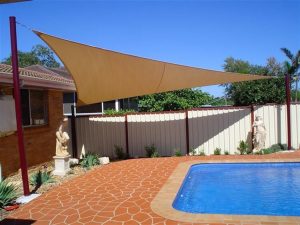 Cream shade sail near pool