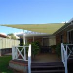 Cream shade sail over outdoor area