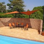 Orange shade sail over chairs