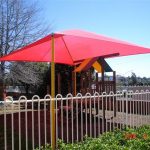 Red shade structure over playground