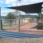 Black Shade Sail over outdoor entertainment area