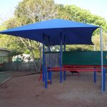 Blue shade structure over playground
