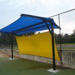Blue and Yellow shade structure at sporting field
