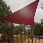 Red Shade Sail over residential Pool